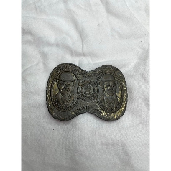 vintage belt buckle featuring "Pinkerton's Gallery" with images of Butch